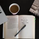 Laptop, open book and coffee on a desk for online learning